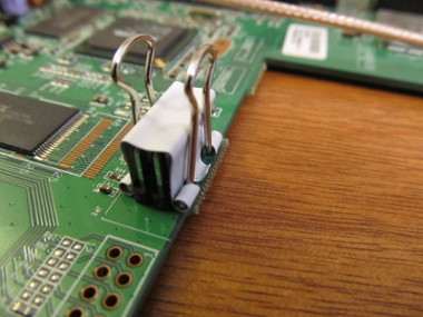 A common binder clip, attached to the unsoldered headers, can keep them lined up while the soldering takes place.