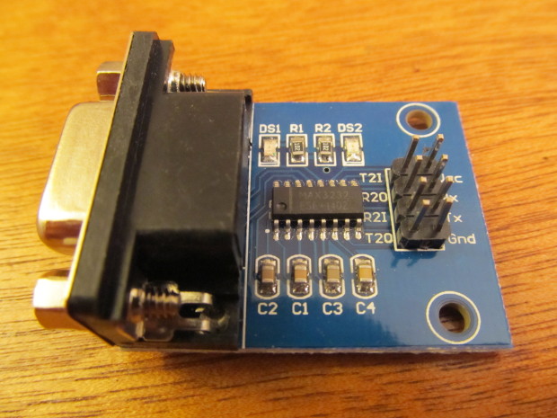 Close-up photograph of the MAX3232 upconverter chip and board, a small DB-9 connector and a bit of blue PCB circuitboard.